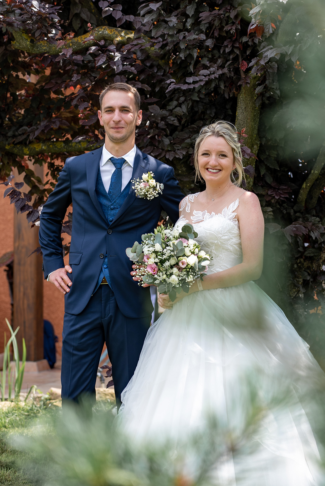 Full length shot of a young couple behind flowers